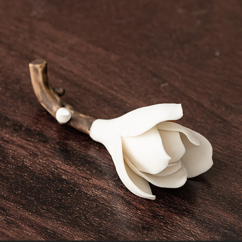 Gardenia Ceramic Incense Burner – White magnolia bud on textured branch, dark wood surface, handmade ceramic