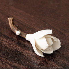 Gardenia Ceramic Incense Burner – White magnolia bud on textured branch, dark wood surface, handmade ceramic