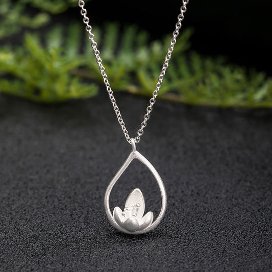 Sterling Silver Lotus Pendant – Teardrop frame with lotus on dark stone, Spiritual