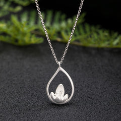 Sterling Silver Lotus Pendant – Teardrop frame with lotus on dark stone, Spiritual
