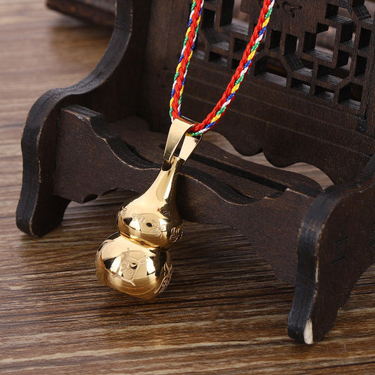 Tibetan Yin Yang Gourd Necklace - Gold gourd pendant on carved wood stand, five-color braided cord
