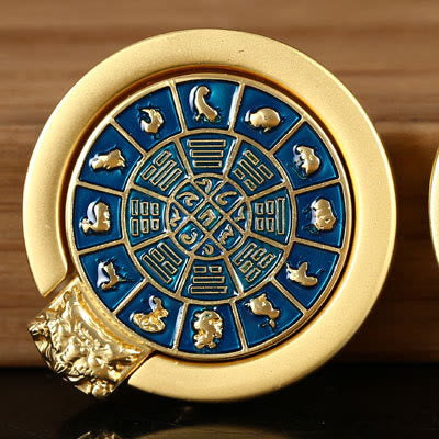 Om Mani Padme Hum Phone Ring Holder – Gold rotating zodiac medallion with blue enamel, feng shui spinner
