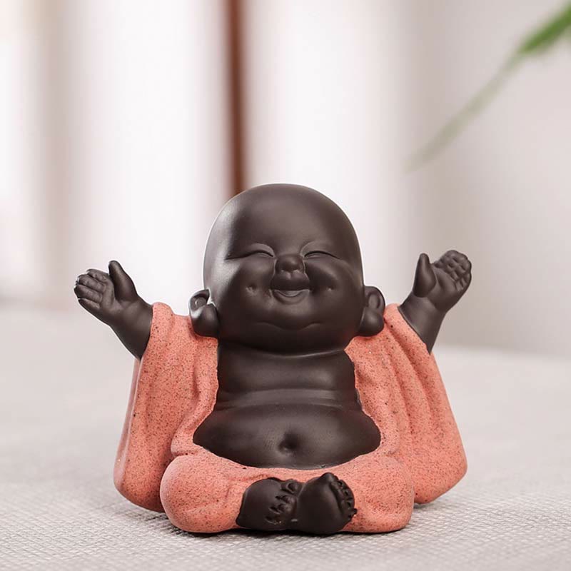 Laughing Buddha Purple Clay Maitreya Statue – two-tone ceramic seated Buddha with arms raised, dark brown skin and speckled coral robe, zen tabletop decor