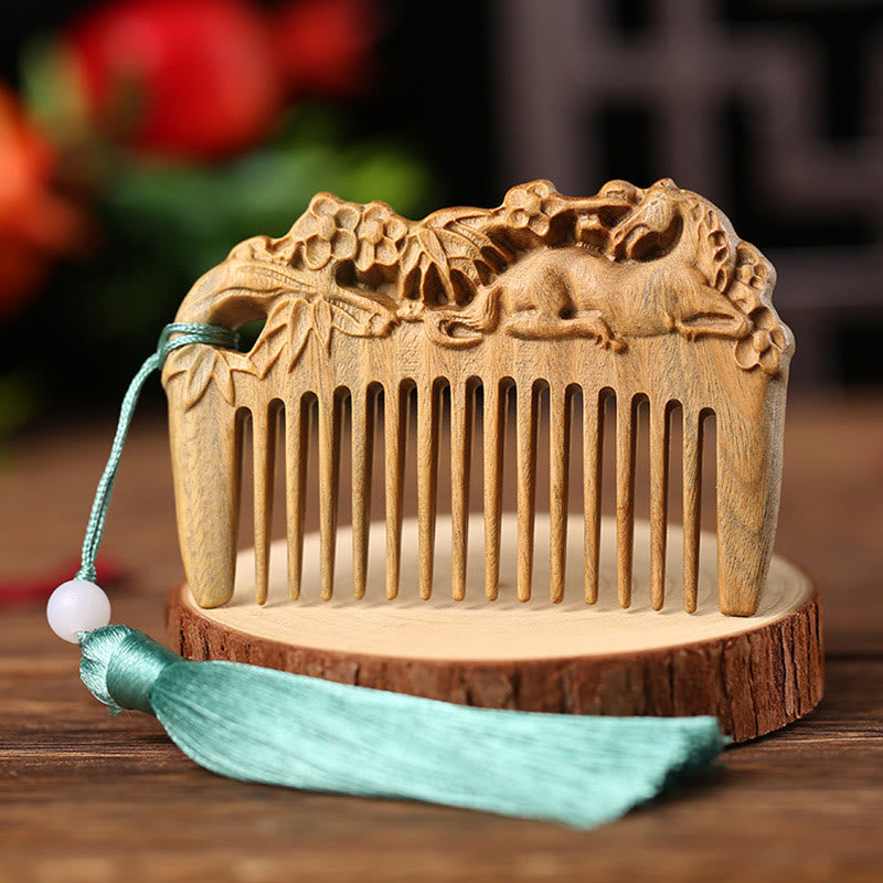 Green sandalwood horse and peony comb displayed on wood slice with light blue tassel