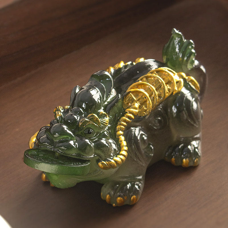 PiXiu Coin Tea Pet – Dark green reclining PiXiu on brown wood surface, wealth home decor