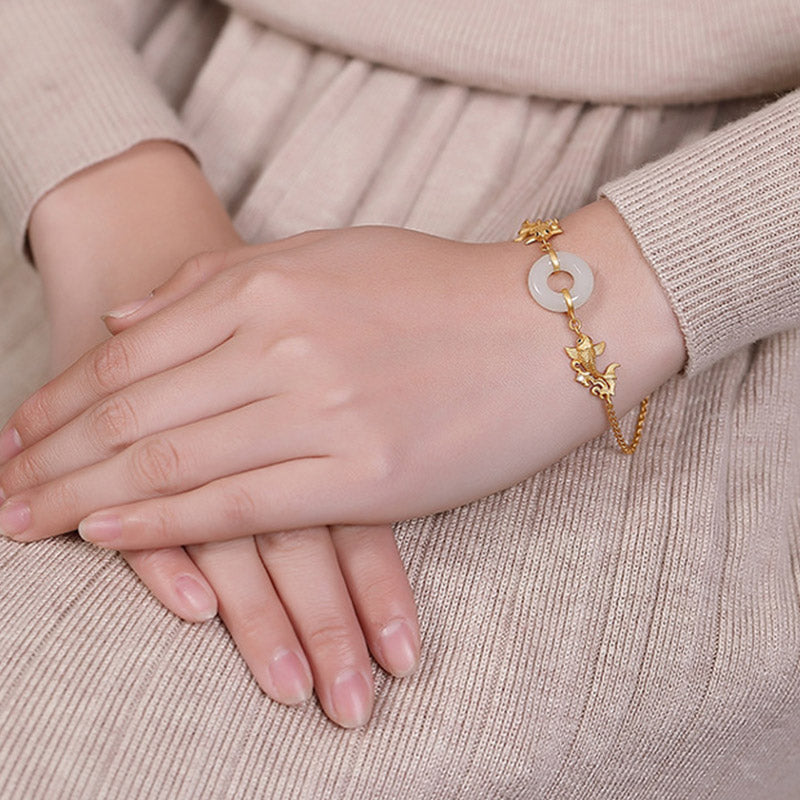 White Jade Koi Bracelet – worn on wrist demonstrating fit and natural luster of jade beads