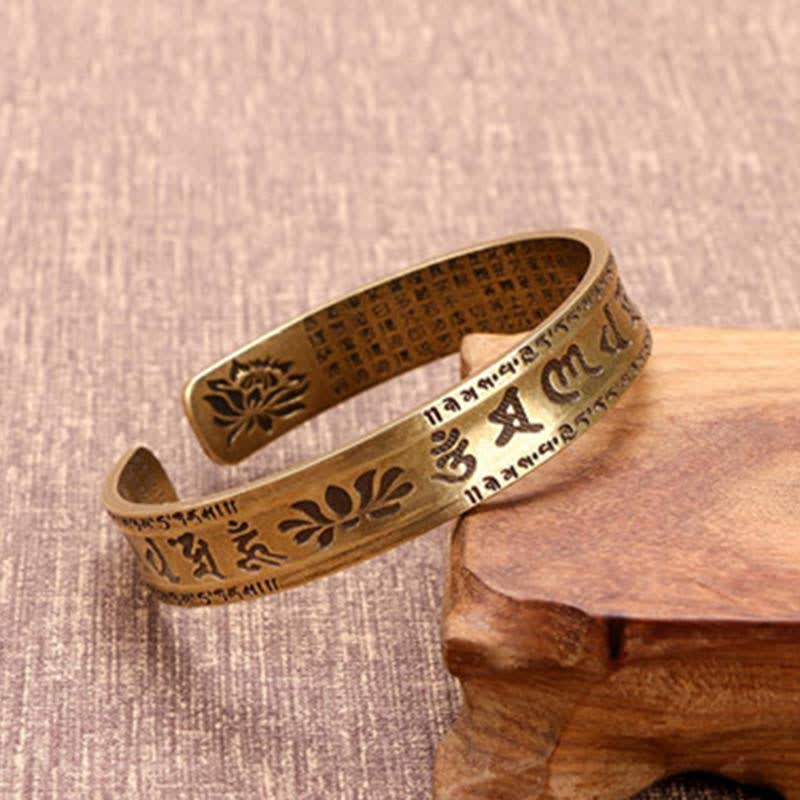 Om Mani Padme Hum Dragon Phoenix Bracelet - Brass cuff with lotus and mantra engravings on wooden stand, Sacred