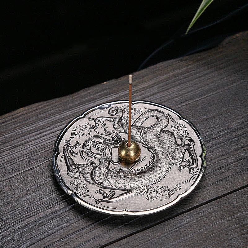 Round Dragon Copper Incense Burner - Silver plate with dragon relief and brass holder on dark wood, zen ritual