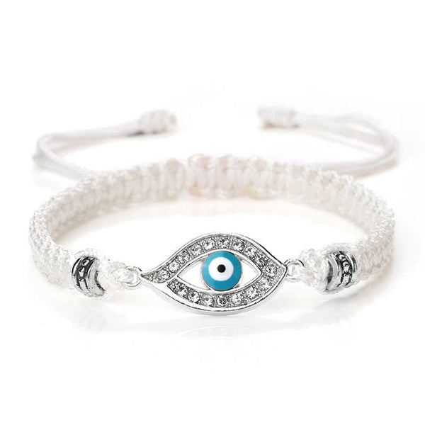 White cord evil eye bracelet with silver turquoise evil eye crystal charm on white bg