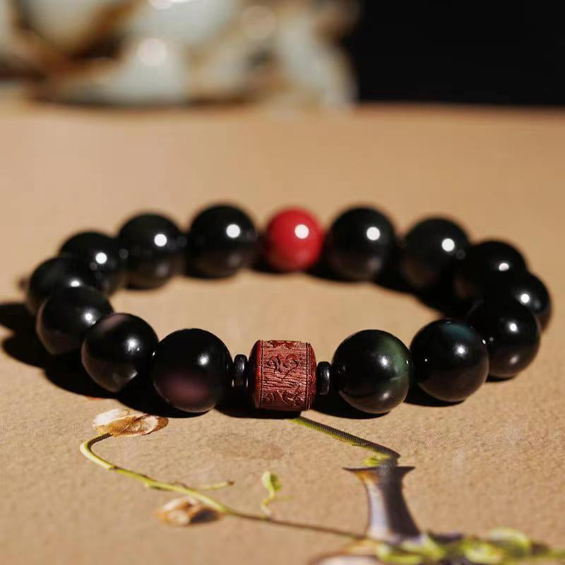 Gold Sheen & Rainbow Obsidian Fu Bracelet – on textured beige with red accent bead, obsidian jewelry