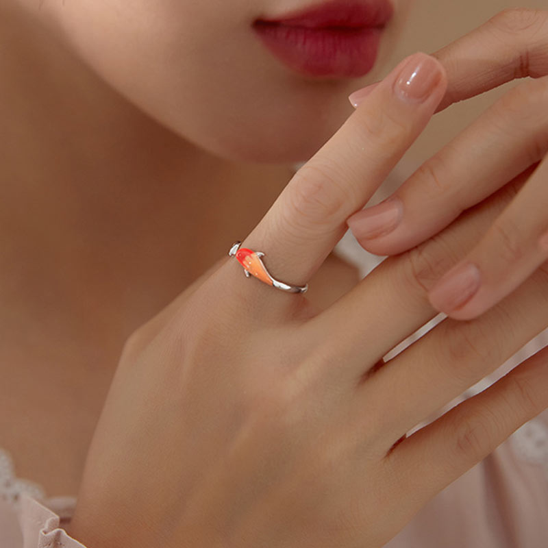 Copper Koi Fish Adjustable Ring – ring on dark festive background with warm copper glow and sparkle effects