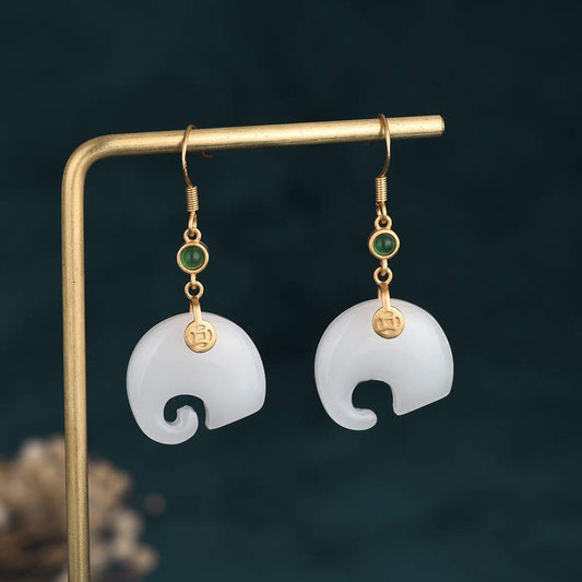 Feng Shui Elephant White Jade Fortune Earrings on gold display stand front view