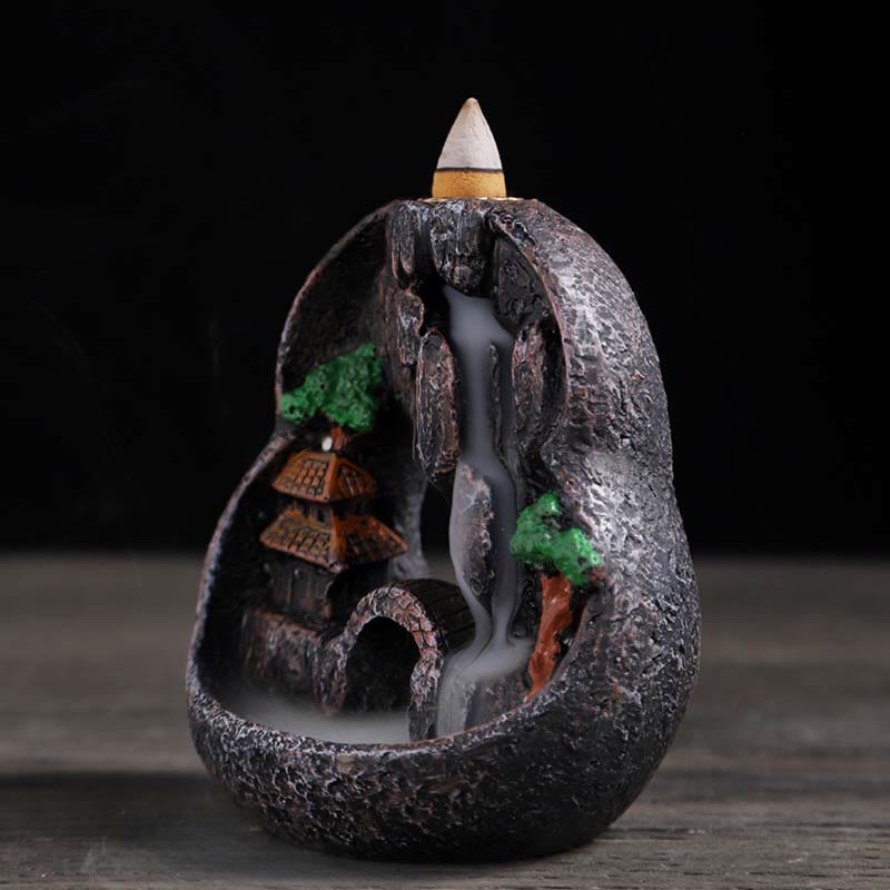Resin Backflow Incense Burner – Round stone orb with pagoda, bridge and smoke flowing through archway, waterfall incense