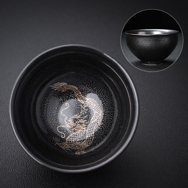 Gold Leaf Jianzhan Teacup – Side angle showing gold dragon phoenix on dark tenmoku glaze, tea ceremony