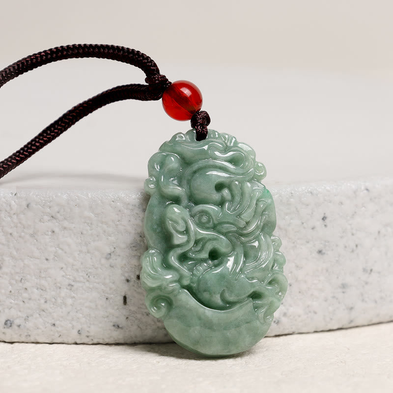 Jade Zodiac Prosperity Necklace – Dragon relief pendant on gray stone, studio lighting, prosperity