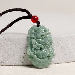Jade Zodiac Prosperity Necklace – Dragon relief pendant on gray stone, studio lighting, prosperity