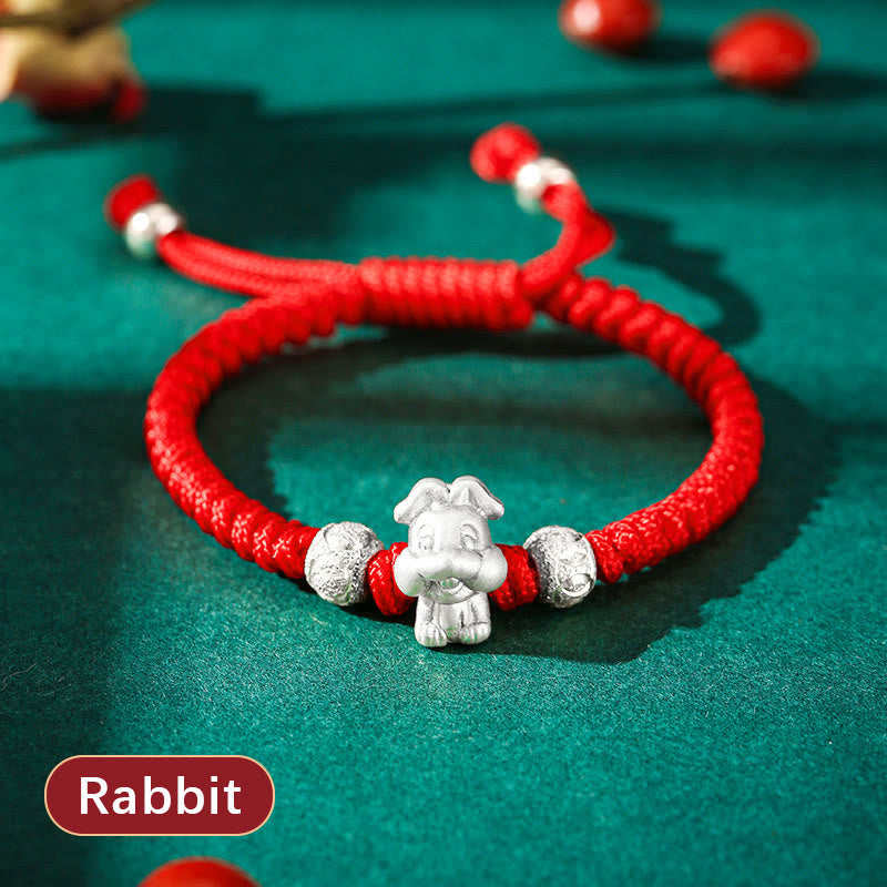 999 Sterling Silver Zodiac Red Rope Kids Bracelet - Silver charm on red cord, adult and child hands, heritage gift