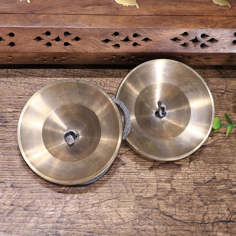 Tibetan Tingsha Bells – Overhead angle showing concave interior and bronze surface, Buddhist ritual bells