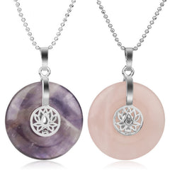Crystal Amethyst Pink Crystal Lotus Necklace – Purple amethyst and pink rose quartz donut pendants on white background, healing crystals