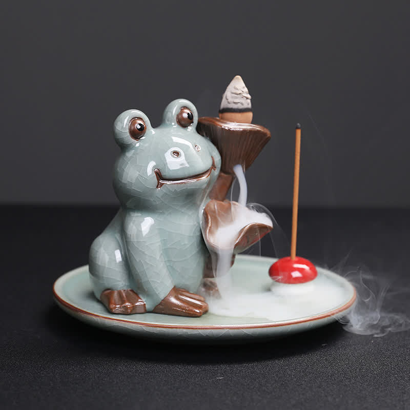 Meditation Frog Ceramic Lotus Incense Burner - 3/4 view with lit backflow cone and smoke cascade, Soothing