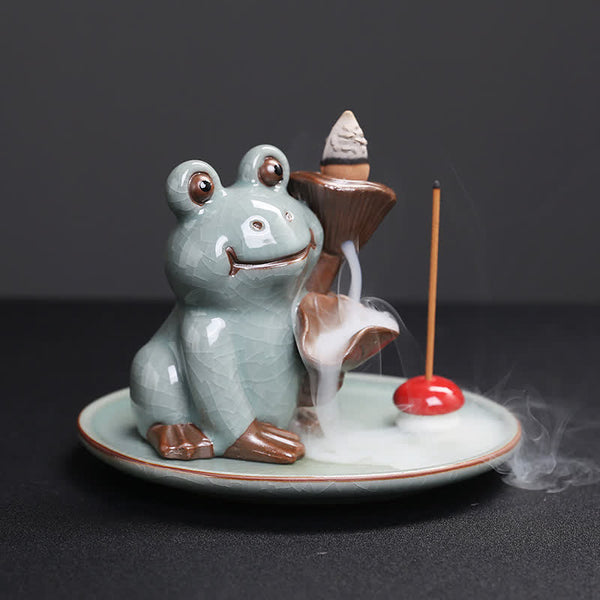 Meditation Frog Ceramic Lotus Incense Burner - 3/4 view with lit backflow cone and smoke cascade, Soothing