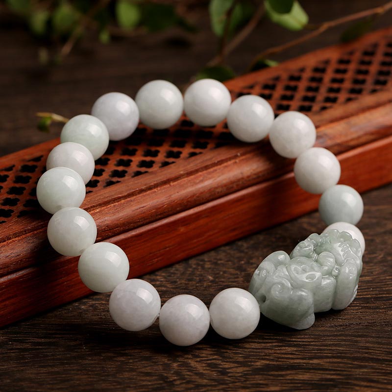 Jade PiXiu Bracelet – Light green jade beads with carved jade PiXiu on wood tray, feng shui wealth jewelry