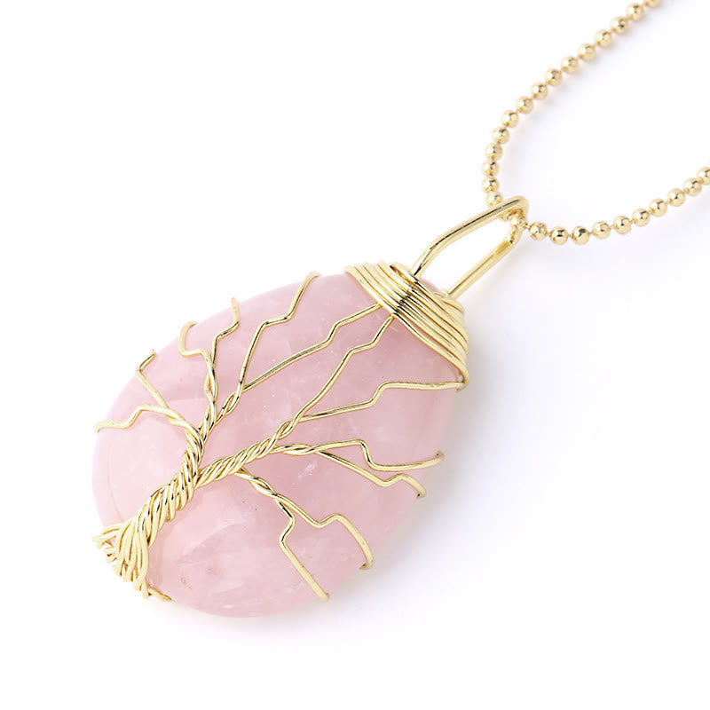 Quartz Crystal Tree of Life Necklace – rose quartz pendant, gold wire tree, three-quarter angle, love healing
