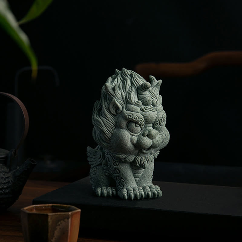 PiXiu Sandstone Statue – Front view on black tray with teaware, moody lighting, spiritual decor