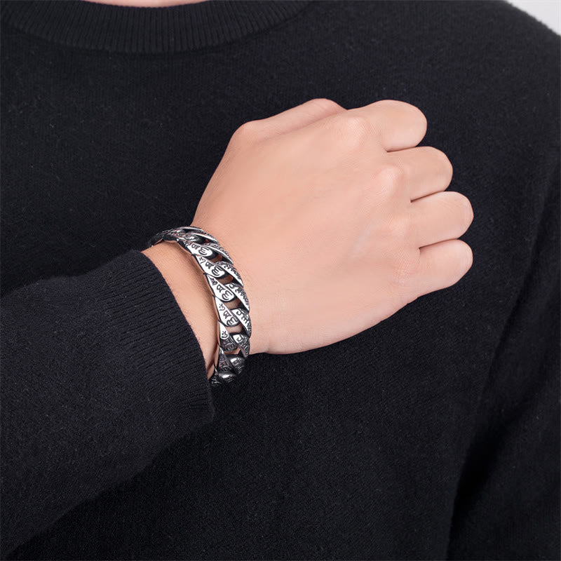 Tibetan Om Mani Padme Hum Cuff Bangle – close-up on wrist with dark clothing, heavy silver chain links, men's jewelry