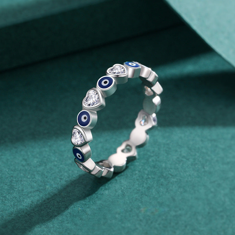 925 Sterling Silver Evil Eye Heart Ring – heart and evil eye pattern on teal velvet jewelry display