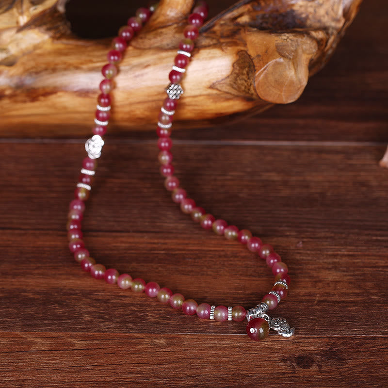 Watermelon Tourmaline Bracelet – Triple wrap on dark wood with silver knot charms