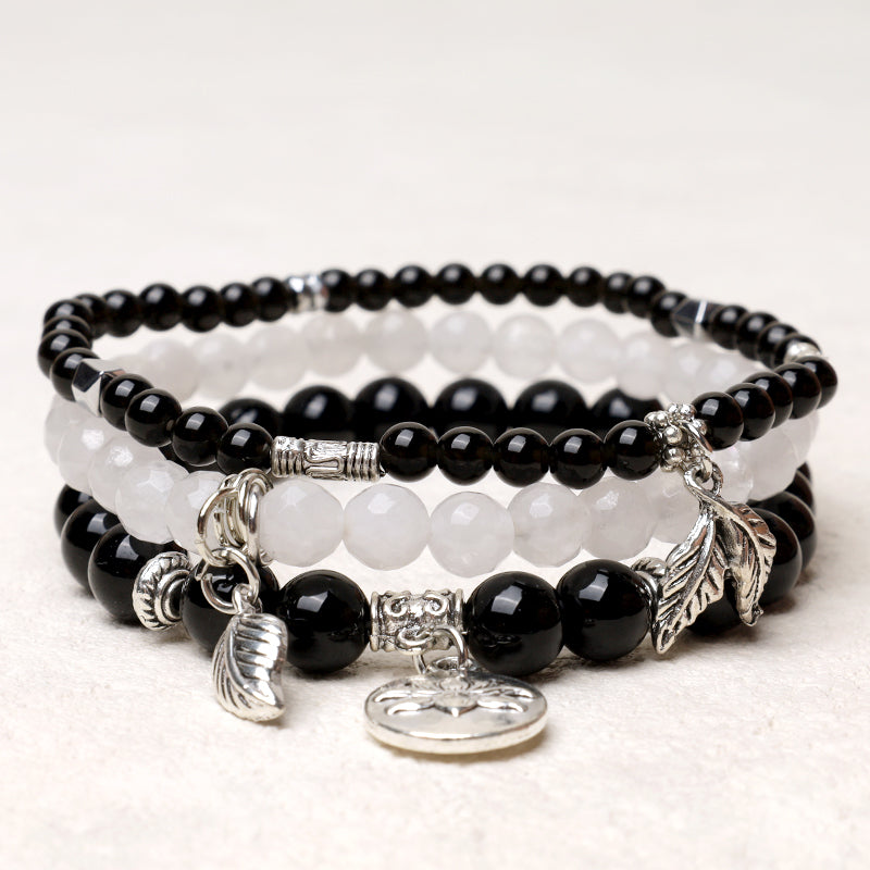 Crystal Lotus Bracelet Set – black onyx and white quartz stack with silver leaf moon and lotus charms, boho jewelry