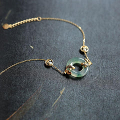Cyan Jade Koi Fish Bracelet - full view showing translucent cyan jade beads with koi charm