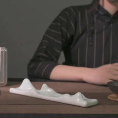 Mountain Cloud Incense Holder – Pale celadon peaks on tea mat, contemplative
