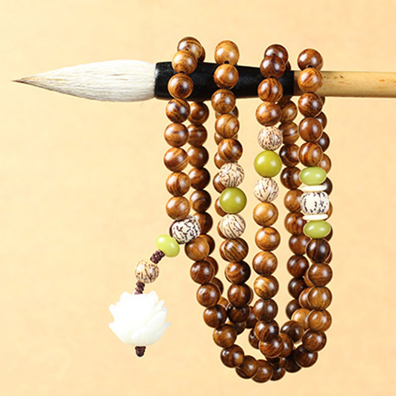 Rosewood Lotus Mala – wood grain beads on calligraphy brush with lotus guru bead, meditation