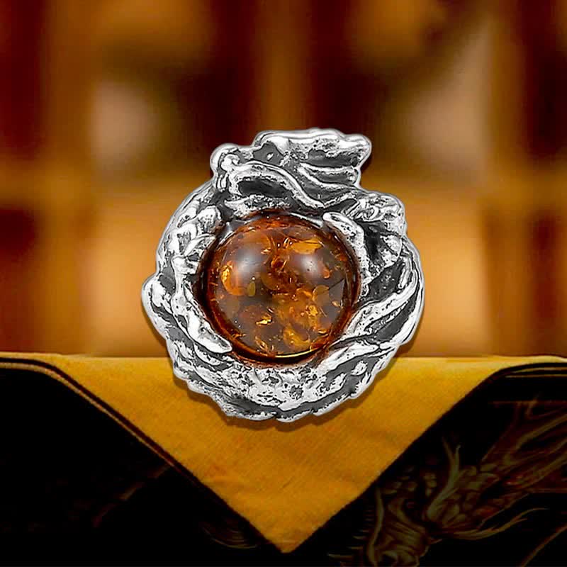 Sterling Silver Amber Dragon Earring – organic root setting with honey amber on gold fabric, Gothic