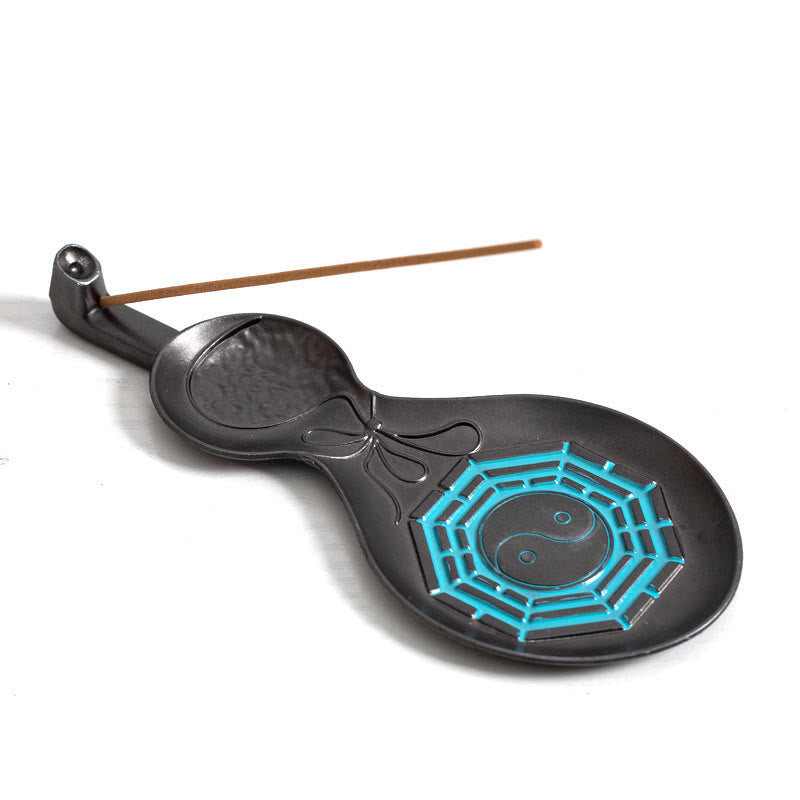 Gourd Yin Yang Bagua Incense Burner – Black gourd with cyan Bagua and incense stick on white background, copper burner