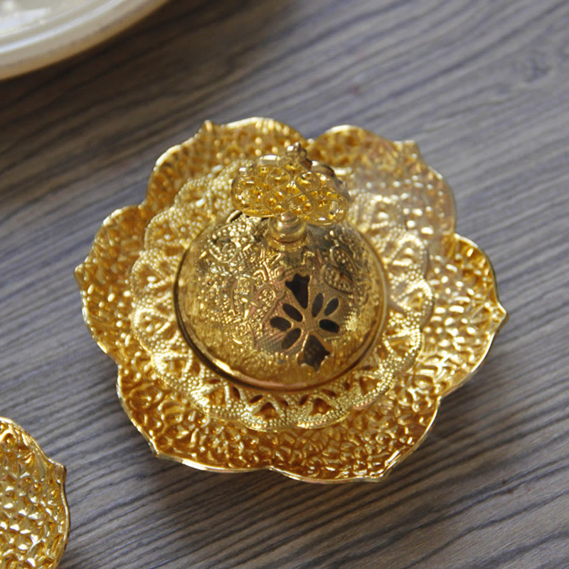 Gold Leaf Coaster Incense Burner nested tiers with ornate finial from above, alloy incense burner close-up