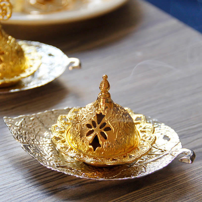 Tibetan Gold Leaf Coaster Incense Burner – Gold dome with silver leaf tray and matching set in bokeh background, brass burner
