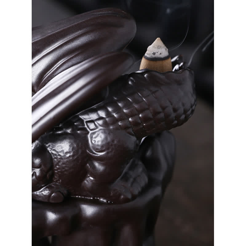 Nordic Dragon Backflow Incense Burner close-up dragon scales and cone, dark ceramic detail shot, backflow incense holder
