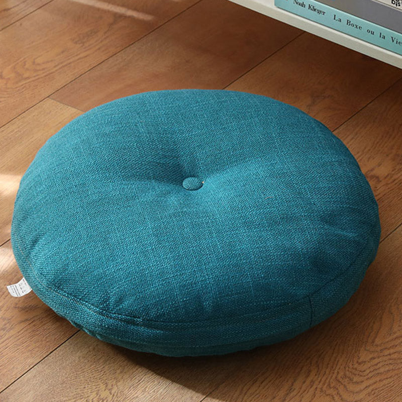 Lotus Linen Meditation Cushion – Vibrant teal tufted on honey-brown hardwood