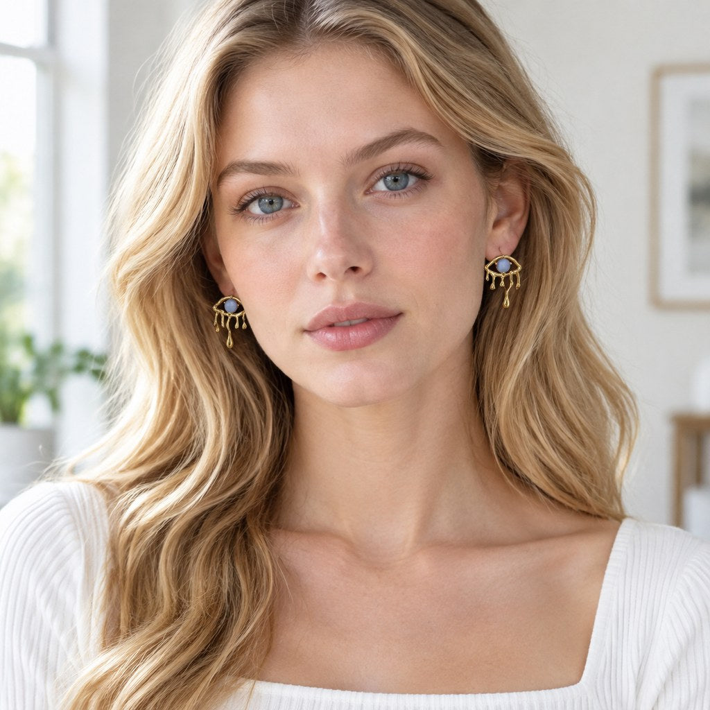 Gold Blue Cat's Eye Drip Earrings - Front model view of the drop silhouette and blue glass stone, women's jewelry