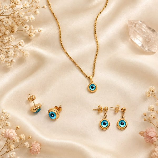 Gold Blue Evil Eye Jewelry Set – Flat lay of the necklace, stud earrings, and dangle earrings