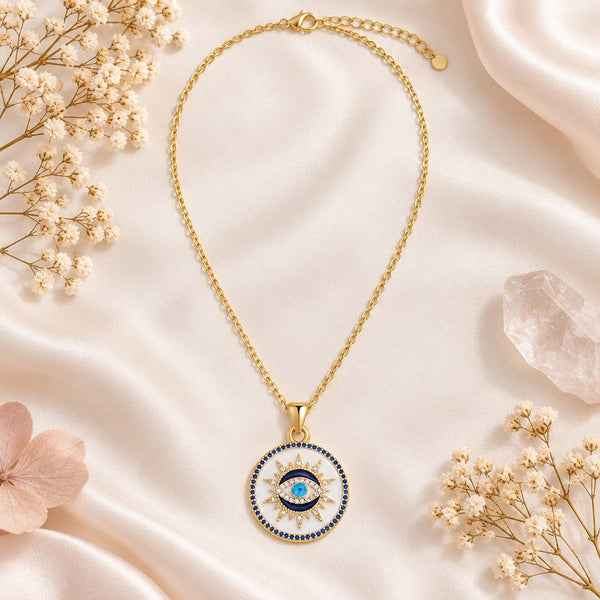 Gold Enamel Sunburst Evil Eye Necklace – Flat lay of gold cable, lobster clasp, extender and white enamel disc