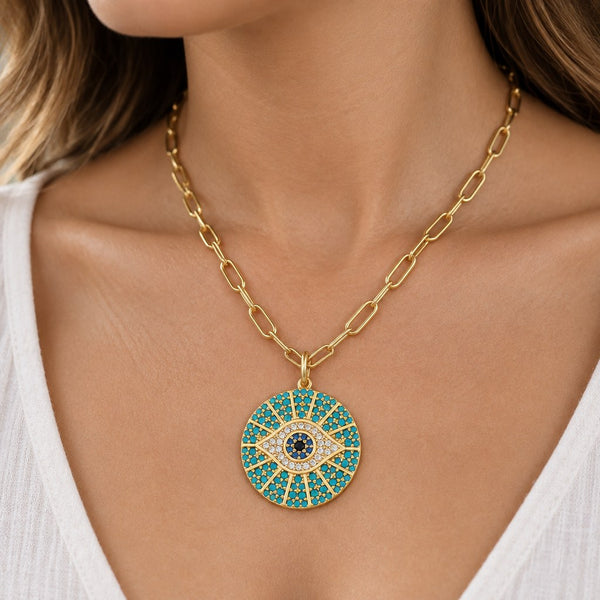 Gold Paperclip Turquoise Sunburst Evil Eye Necklace – Neck close-up of the turquoise crystal sunburst evil eye pendant