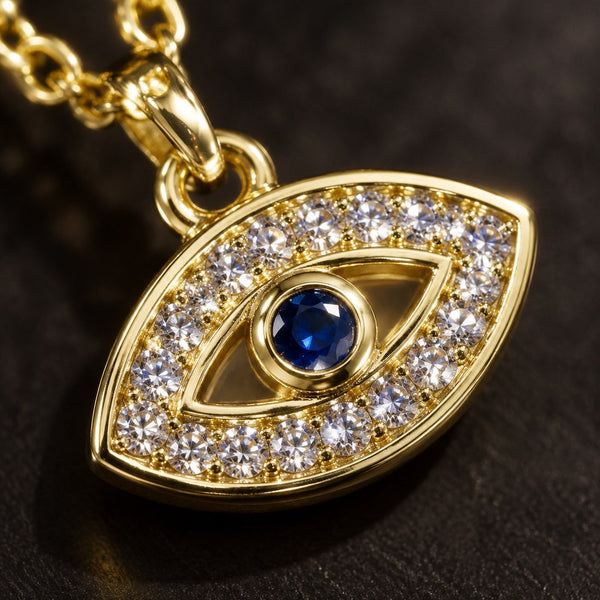 Gold Pave Evil Eye Necklace – Macro of two-row white pave lids and bezel-set sapphire centre