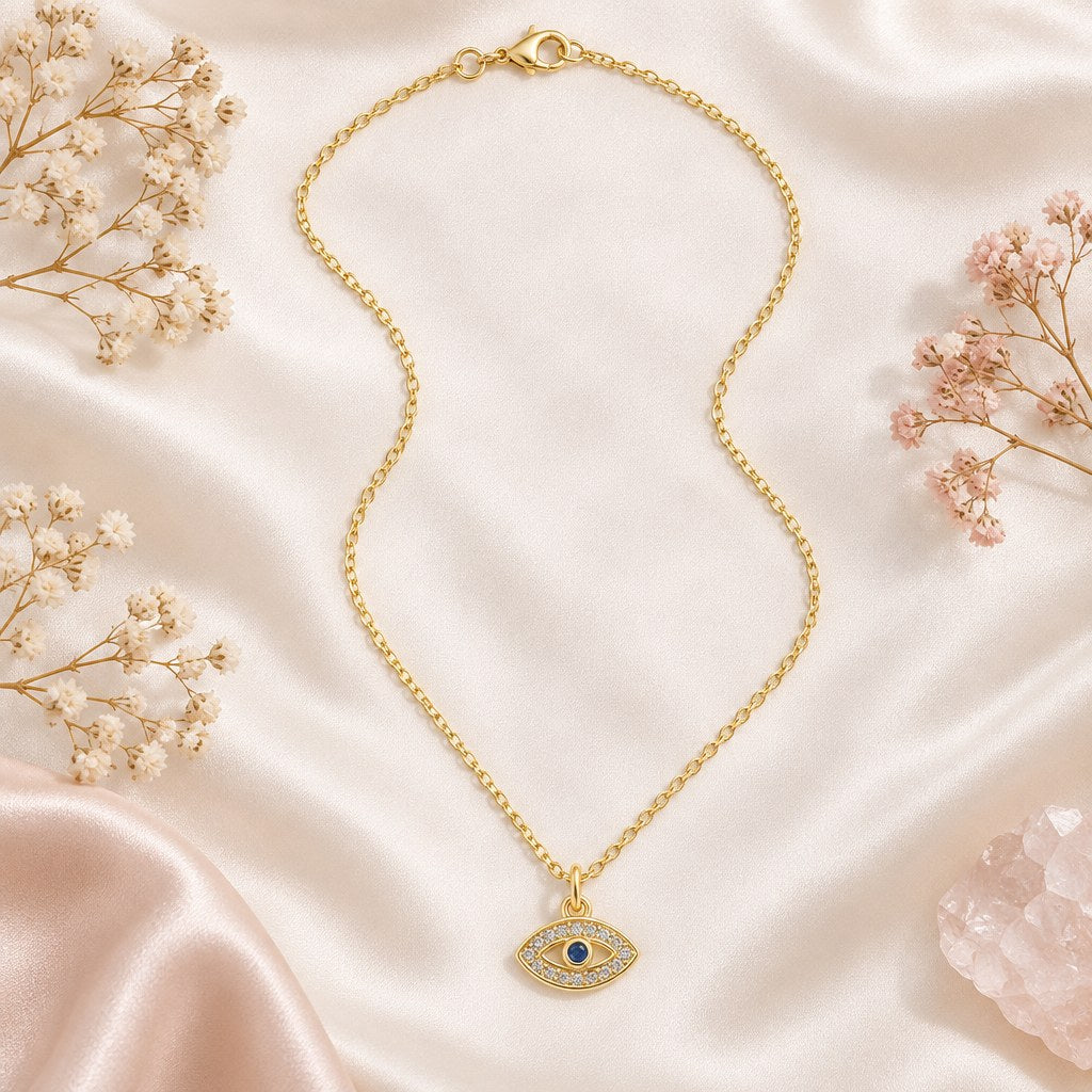 Gold Pave Evil Eye Necklace – Flat lay of gold cable chain, lobster clasp, extender and pave eye