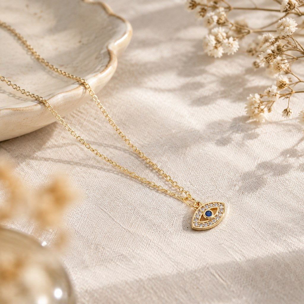 Gold Pave Evil Eye Necklace – Linen styling with dried flowers and gold pave evil-eye pendant