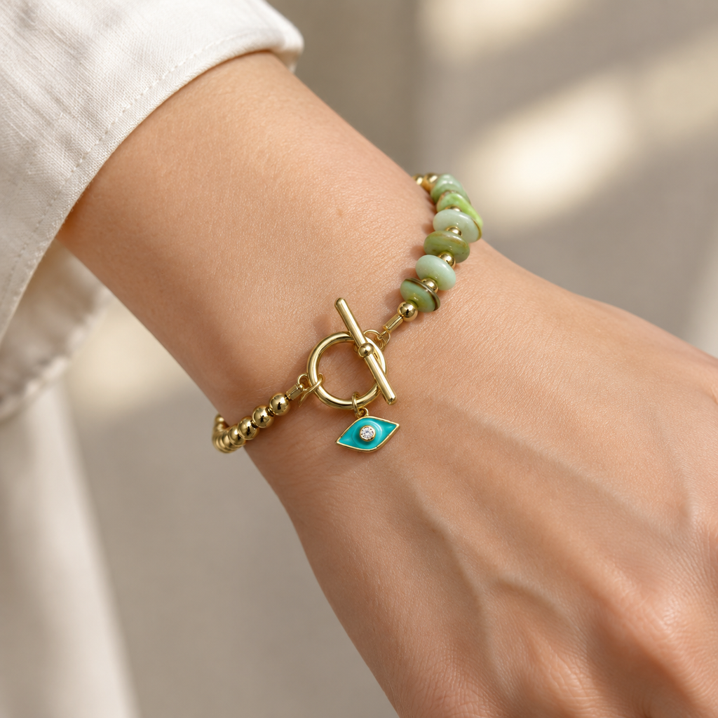 Gold Plated Copper Evil Eye Toggle Bracelet - Green Eye Bead - worn close up