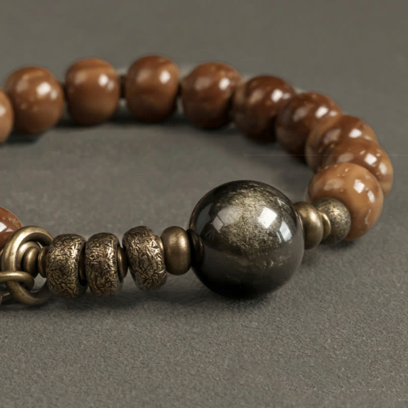 Tiger Eye Obsidian Wealth Bracelet – Caramel wood beads with dark pewter sphere and etched brass spacers on neutral gray background